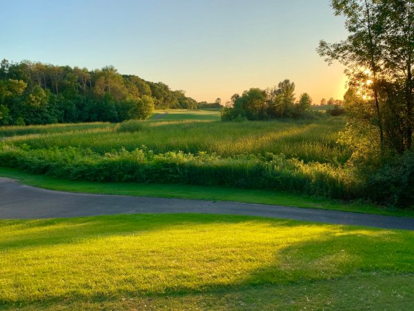 Path of golf course at sunset